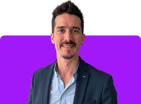 Alfonso Peralta A professional man in a suit with a confident smile, representing versatility and expertise in various trades and skills, perfect for the Mind of All Trades brand.